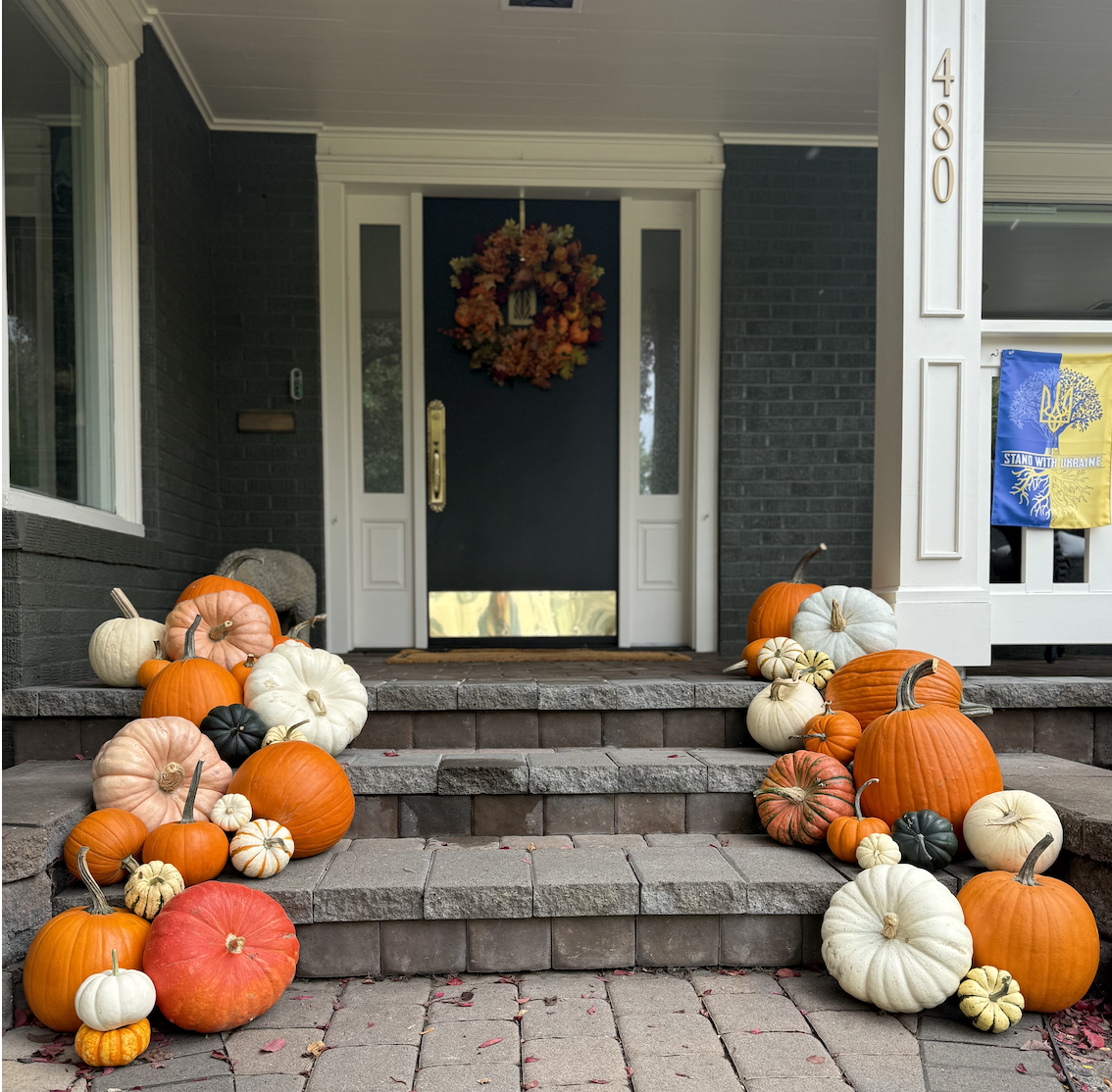 Screenshot 2025-09-14 at 4.07.43 PM pumpkins on a porch